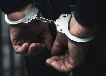 Two individuals booked for assaulting police after being told to lower music volume.