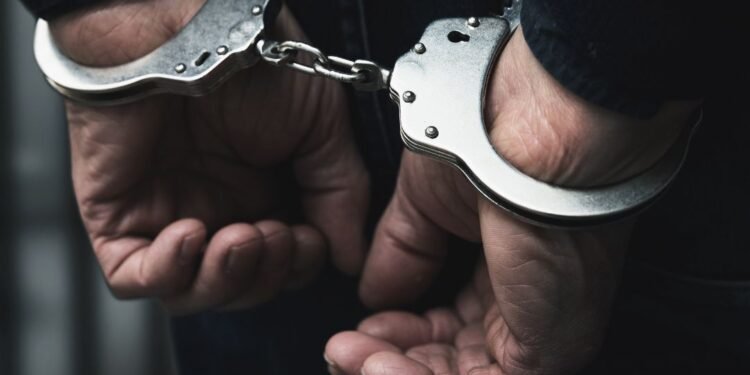 Two individuals booked for assaulting police after being told to lower music volume.