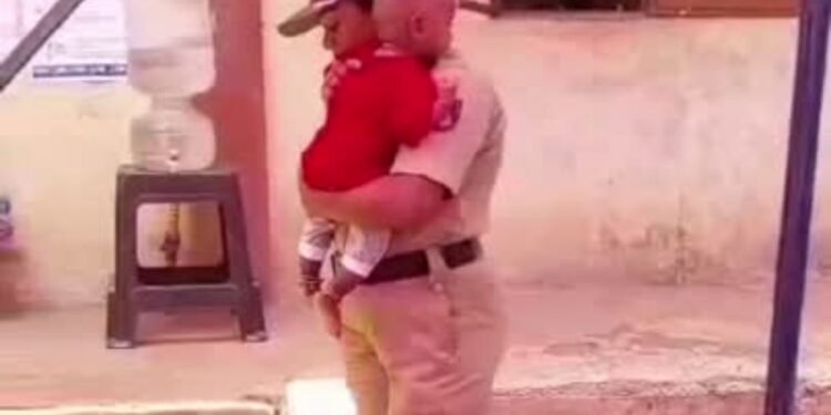 Belgaum Police Constable Balances Security Duty with Childcare at Polling Booth